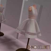 Маленькое белое платье на манекене