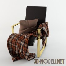 Кресло с клетчатым пледом и подушкой