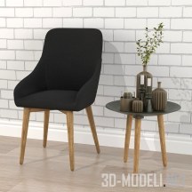 Черное кресло со столиком и вазами