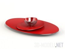 Красные овальные тарелки и миска