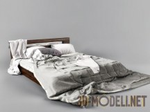 Деревянная кровать с постельным бельем