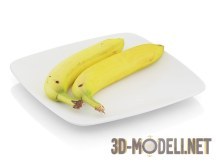 Два банана на тарелке