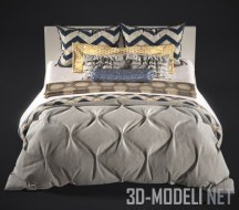 Кровать со стеганым одеялом и подушками