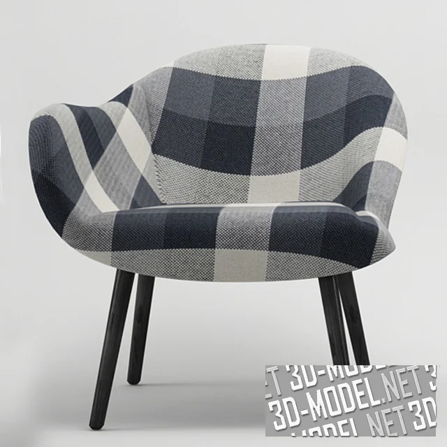 Ассиметричное кресло с клетчатой обивкой